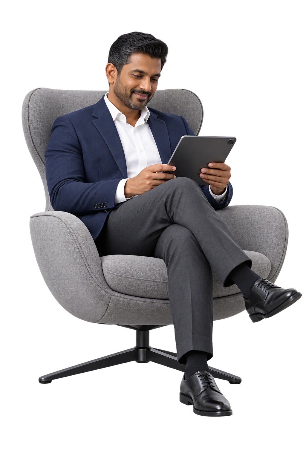 A business owner relaxing in a chair, reviewing his business on a tablet